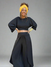 2-piece outfit set with a long cropped top and wide leg pants with high slits.