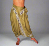 Green harem pants with ethnic print, adjustable elastic waist and tie belt.