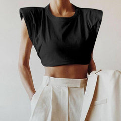 Black crew neck crop top with cap sleeves and shoulder pads.