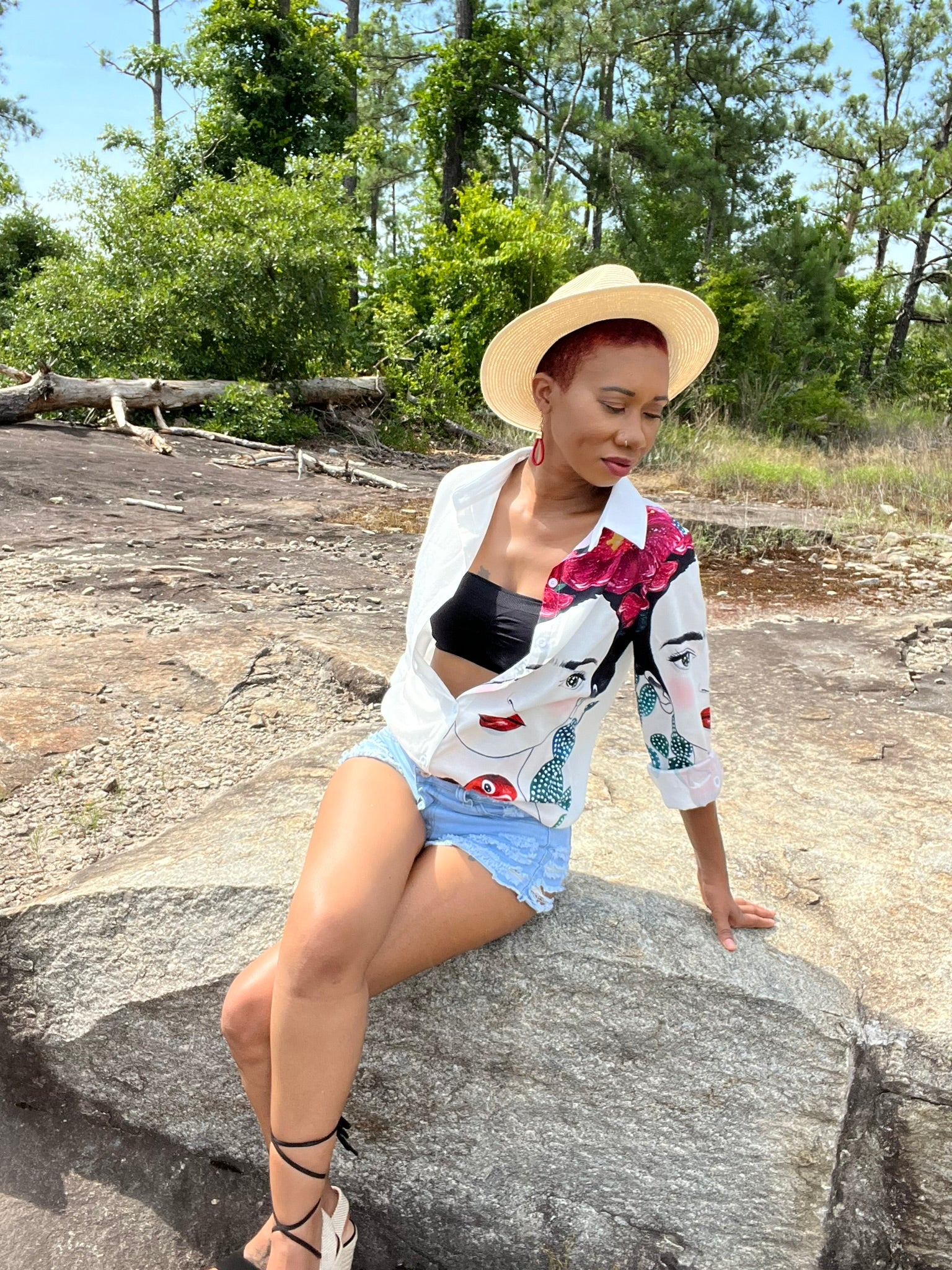 Model wearing the Frida Kahlo Paradise blouse open styled with black bandeau