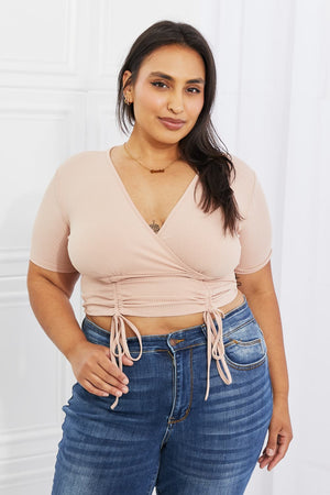 Blush ribbed front scrunched crop top with surplice neckline and short sleeves