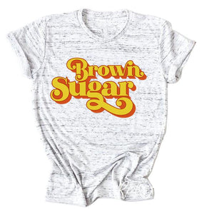 Heather Gray Short Sleeve Graphic T-Shirt with Brown Sugar written in Yellow with a Red Drop Shadow. 