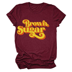 Maroon Short Sleeve Graphic T-Shirt with Brown Sugar written in Yellow with a Red Drop Shadow. 