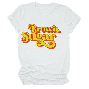 White Short Sleeve Graphic T-Shirt with Brown Sugar written in Yellow with a Red Drop Shadow. 