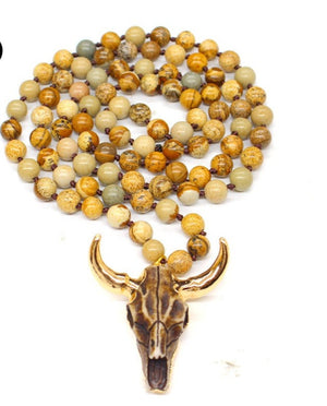 Brown Longhorn Bull Skull Necklace with lava stone beading.