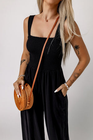 Black smocked sleeveless wide leg jumpsuit with pockets