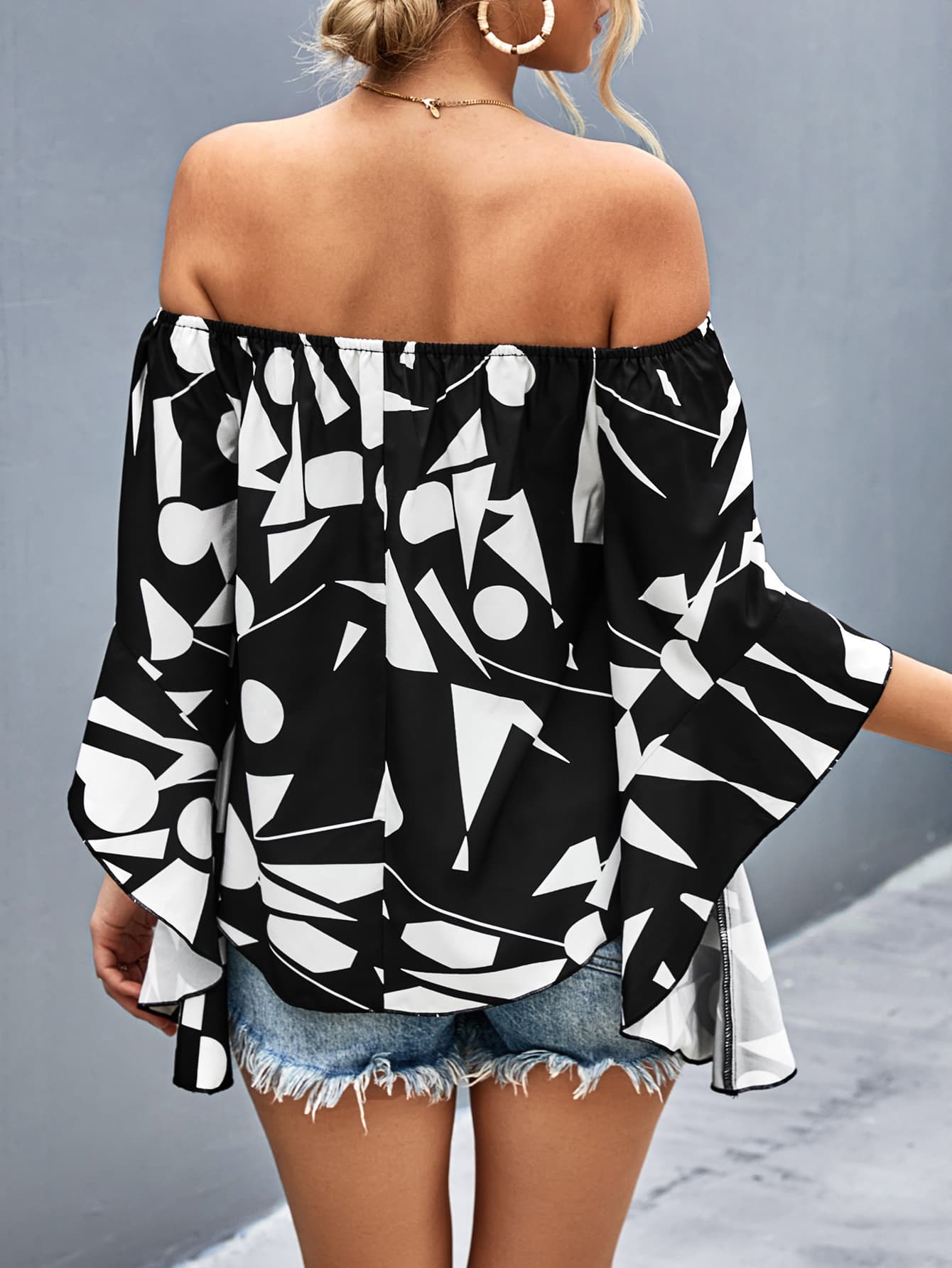 Geo print off-shoulder bell sleeve blouse in black and white