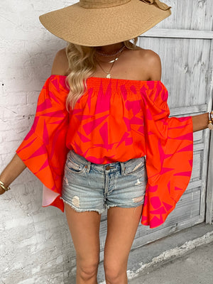 Geo print off-shoulder bell sleeve blouse in orange