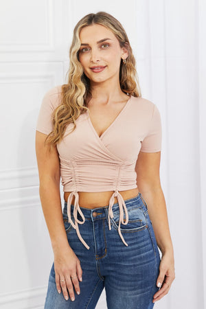 Blush ribbed front scrunched crop top with surplice neckline and short sleeves