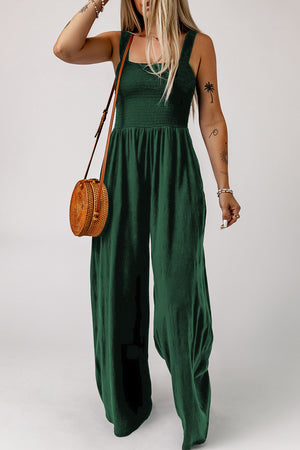 Green smocked sleeveless wide leg jumpsuit with pockets