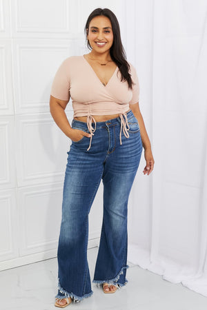 Blush ribbed front scrunched crop top with surplice neckline and short sleeves