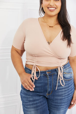 Blush ribbed front scrunched crop top with surplice neckline and short sleeves