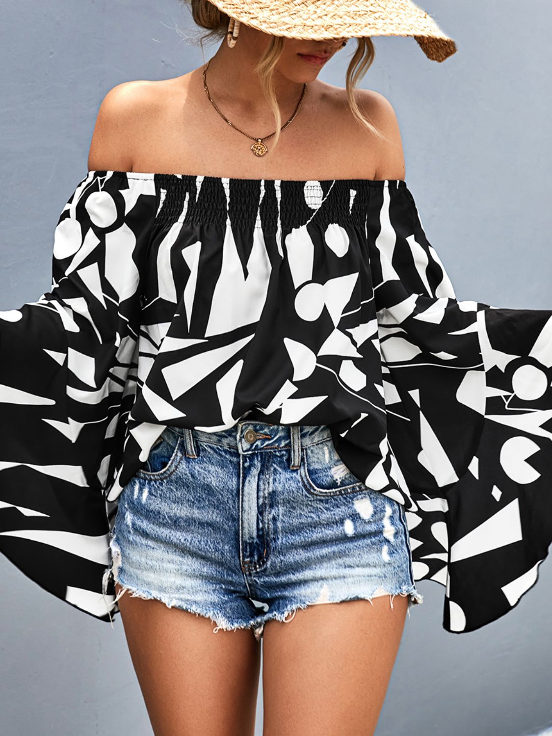 Geo print off-shoulder bell sleeve blouse in black and white