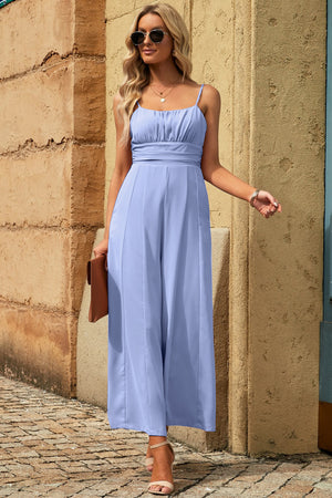 Sky blue spaghetti strap wide leg jumpsuit with seam detail and cutout tieback