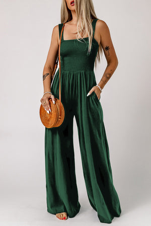 Green smocked sleeveless wide leg jumpsuit with pockets