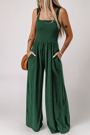 Green smocked sleeveless wide leg jumpsuit with pockets