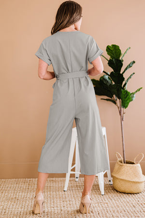 Light gray button front belted cropped jumpsuit with pockets