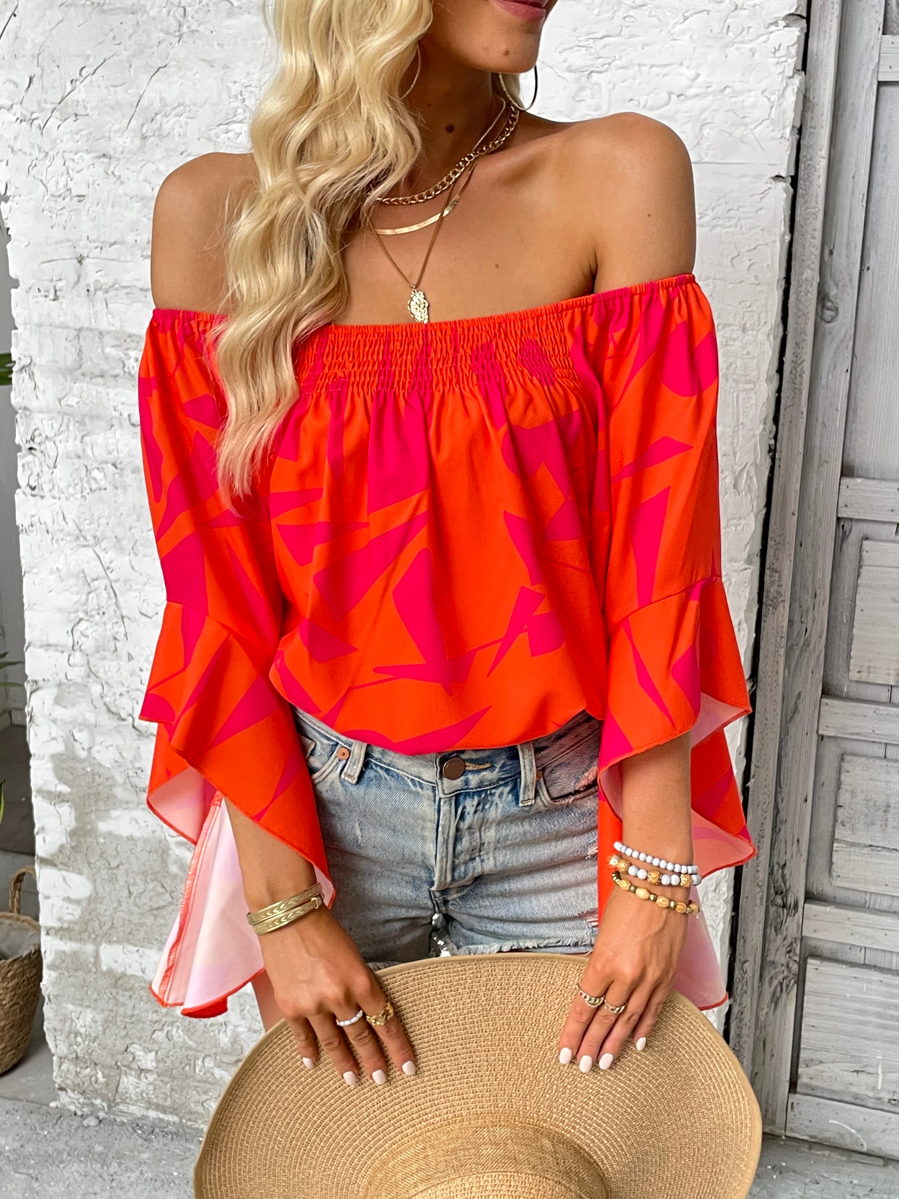 Geo print off-shoulder bell sleeve blouse in orange