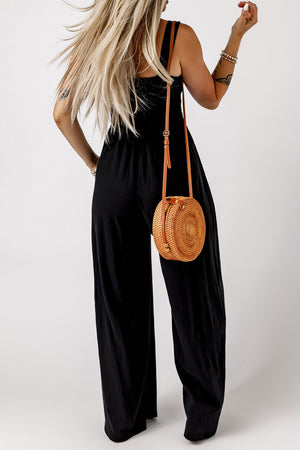 Black smocked sleeveless wide leg jumpsuit with pockets