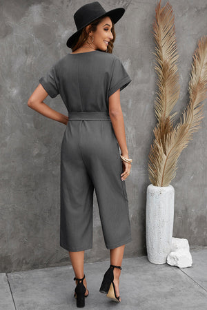 Dark gray button front belted cropped jumpsuit with pockets