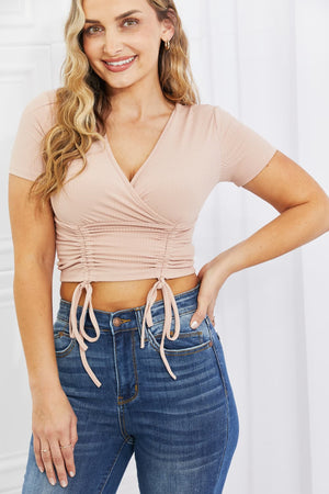 Blush ribbed front scrunched crop top with surplice neckline and short sleeves